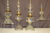 Four Matching Oil Lamps.