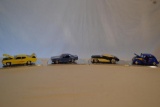 4 Die Cast Cars in Display Cases