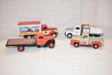 Four Old Time Delivery Truck Toys.