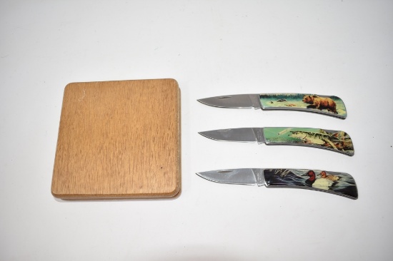 Three Folding Hunting Scene Knives with Display