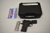 Gun. Colt Defender Lightweight 9 mm Pistol.