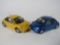 Two Volkswagen New Beetles by Franklin Mint 1:24 scale diecast model cars.