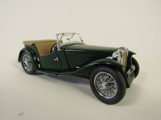 1948 MG TC Roadster Franklin Mint 1:24 scale die-cast model car. Presents with soft top and boot.