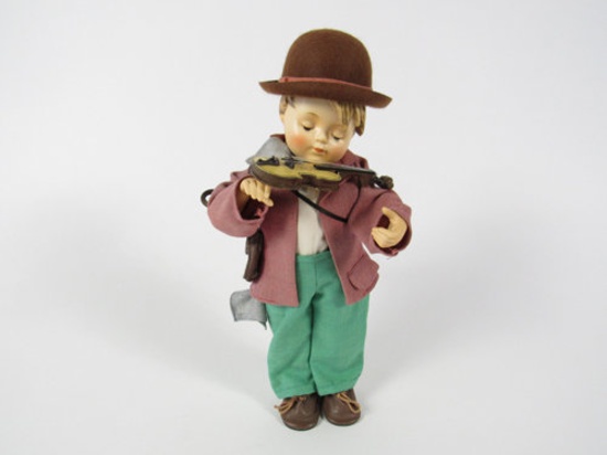 Large Hummel Fiddler Boy porcelain doll. Near Mint Condition. Has fiddle and umbrella but no bow.