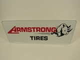 NOS Armstrong Tires horizontal tin sign with running Rhino graphic.