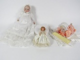 Lot of two porcelain faced baby dolls and one early wedding doll.