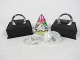 Lot of five Swarovski Crystal paper weights in boxes.