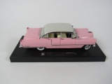 Elvis Pink Cadillac MRC diecast scale model on display base.