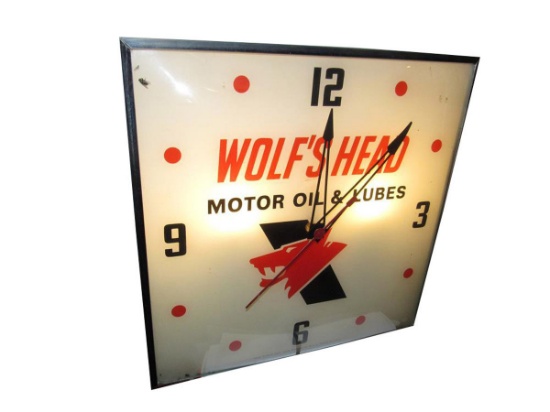 Fabulous 1960s Wolf's Head Motor Oil glass-faced light-up service station clock by Pam Clock Co.
