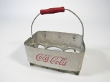 Choice 1930s Drink Coca-Cola aluminum six-pack carrier with wooden handle.