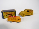 NOS vintage Matchbook Coca-Cola 2-ton delivery truck and a cast metal Coca-Cola truck.