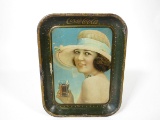 Very scarce 1921 Drink Coca-Cola metal serving tray with period model holding a flared glass.