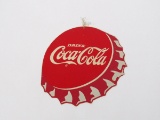 Drink Coca-Cola bottle-cap shaped cardboard string pull sign.