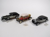 Lot of three Franklin Mint 1:24 scale die cast model cars.