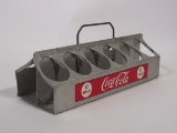 Scarce 1950s Coca-Cola 12-bottle aluminum carrier. Marked: Property of Coca-Cola Bottling Plant.