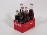 1960s Coca-Cola six-pack carrier made of plastic.