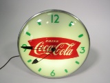 Awesome circa 1950s Drink Coca-Cola glass-faced light-up diner clock with fishtail logos.