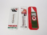 Lot of three reproduction tin service station thermometers.
