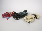 Lot consisting of a CMC 1936 Mercedes 500K 1:24 scale, Maisto 1:18 Jaguar XK8, and a 1:18 Auburn