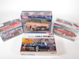 Lot of four unopened model kits by Revell and Monogram.