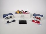 Department 56 Snow Village lot of three ceramic automobiles and a crystal Ford logo display piece.