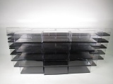 Large lot of 60 diecast car display cases.