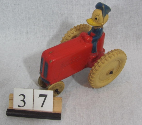 1 in lot, Mickey's Rubber Tractor driven by Daffy Duck, made in Canada by V