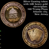 Silver Gaming token with 24K heavy gold electroplate. $40 Trump Plaza Atlantic city, New Jersey.