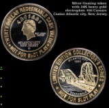 Silver Gaming token with 24K heavy gold electroplate. $20 Caesars Casino Atlantic city, New Jersey.