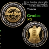 Silver Gaming token with 24K heavy gold electroplate $20 Hard Rock Hotel  Grades NG