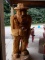 LARGER WOOD CARVING OF POPCORN SUTTON INCLUDES ICONIC CIGARETTE AND MOONSHINE JAR