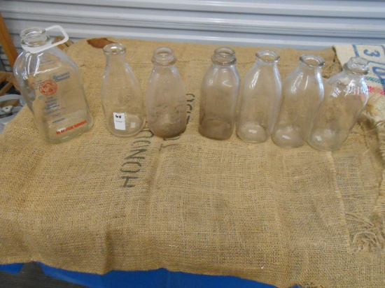 QTY 7) GLASS MILK JARS 1) 1/2 GALLON, 6) QUART