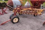 NEW HOLLAND 256 ROLLABAR HAY RAKE W/ DOLLY WHEEL TAG# 6000