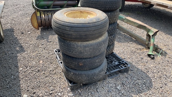QTY 4) 15" UNIVERSAL EQUIPMENT TIRES AND RIMS