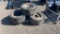 QTY 4) SKID STEER SOLID TIRES AND WHEELS