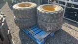 QTY 4) CAT 12-16.5 SKID STEER TIRES AND WHEELS