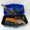 Collection of vintage knife sheaths in tackle box