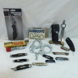 Vintage pocket knives, handcuffs, Versa tool