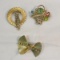 3 vintage gold tone brooches