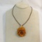 Vintage necklace with carved Bakelite rose pendant
