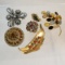6 vintage unmarked Brooches