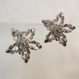 Signed Pastelli silver tone floral clip earrings