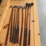 Vintage wood & metal golf clubs in bags