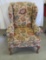 Wingback chair with floral & pine cone fabric