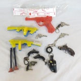 Keychain cap guns, plastic tommy guns