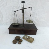 Antique balance scale with some weights