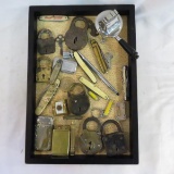 Group of locks with keys, lighter and knives