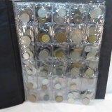 Binder full of mixed foreign coins