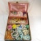 Vintage pearls, beads and brooches in jewelry box