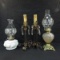 2 Oil Lamps and pair of electric candlesticks